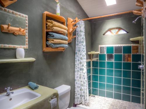 a bathroom with a sink and a toilet and a shower at La Cima del Mundo in Chimirol