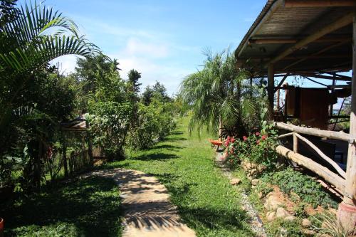 a path in a garden next to a house at La Cima del Mundo in Chimirol
