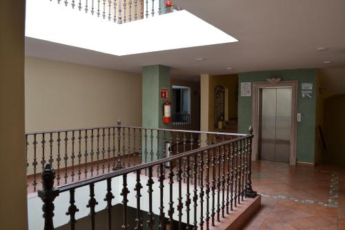 a staircase in a building with a skylight at Hotel San Angel in San Juan de los Lagos