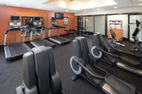 a gym with rows of cardio equipment in a room at Red Lion Hotel Redding in Redding