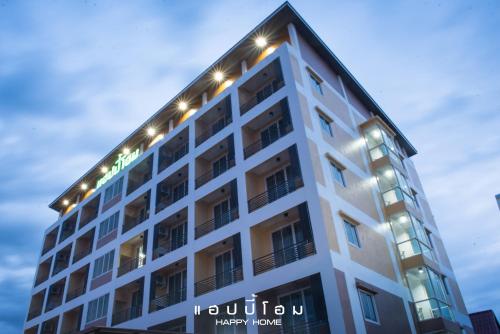a building with lights on top of it at Happy Home in Ratchaburi