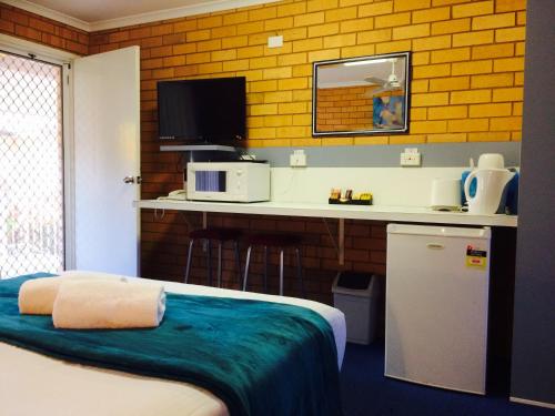 Postel nebo postele na pokoji v ubytování Bosuns Inn Motel