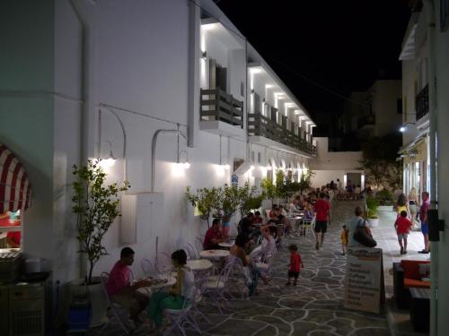 a room filled with lots of furniture and people at Xenia Hotel in Naxos Chora