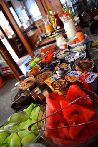 a table with a bunch of fruit on it at Theatre Apartments in Bitola