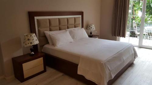 Postel nebo postele na pokoji v ubytování Hotel Magllara