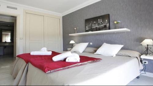 A bed or beds in a room at Center Puerto Banus -3 bedrooms