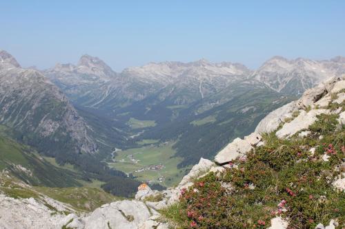 a view of a valley in the mountains at Hotel Garni Lärchenhof in Lech am Arlberg