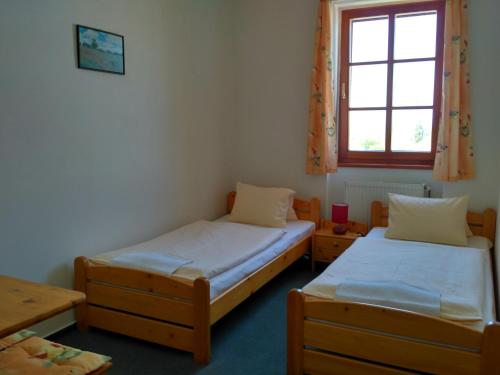 Postel nebo postele na pokoji v ubytování Penzion Bouquet