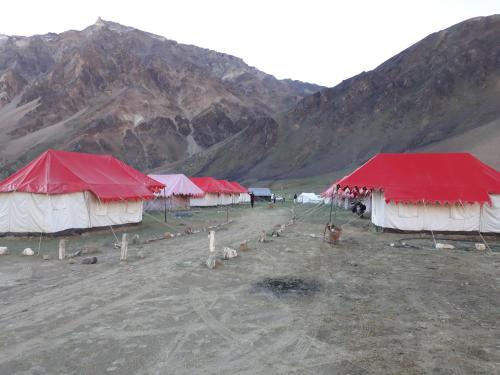 a group of tents with mountains in the background at Himalayan Routes Camp Sarchu in Sir Bhum Chun