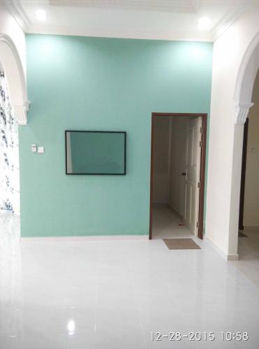 a room with a blue wall and a doorway at PCB Homestay in Kota Bharu