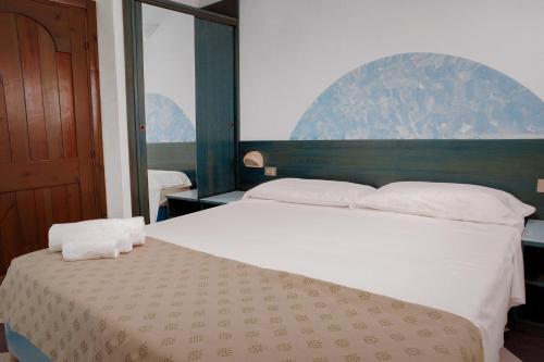 Säng eller sängar i ett rum på Residence Verde Mare Official Site