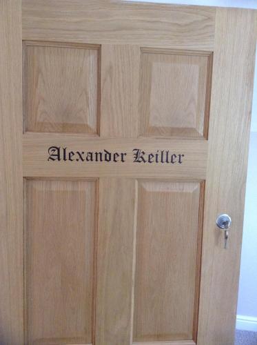 a wooden door with the alverner kettler written on it at B&B Dorwyn Manor in Avebury