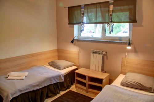 Posteľ alebo postele v izbe v ubytovaní Hotel Kama Park