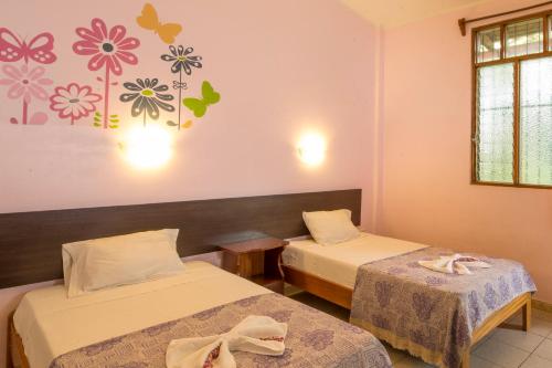 Ένα ή περισσότερα κρεβάτια σε δωμάτιο στο Bubinzana Magical Lodge
