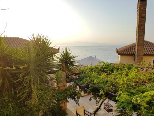 a view of the ocean from a resort with plants at Vrachokipos in Souvala