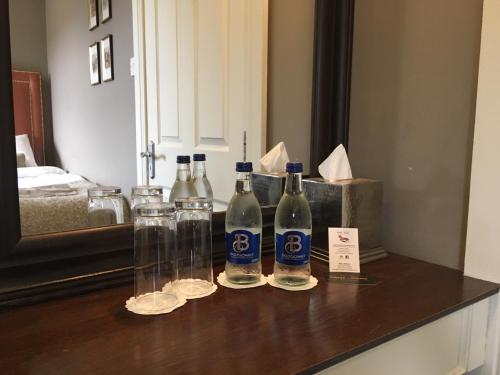 a group of bottles and glasses sitting on a counter at Horse & Hound in Delgany