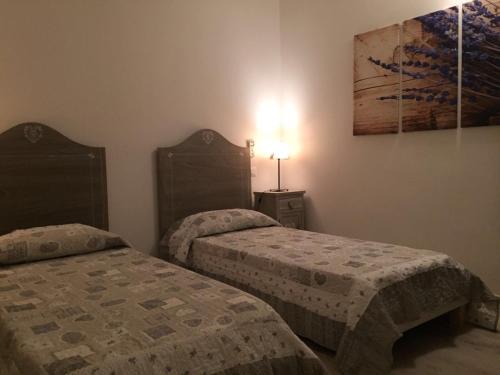 Postel nebo postele na pokoji v ubytování Casetta Lavanda