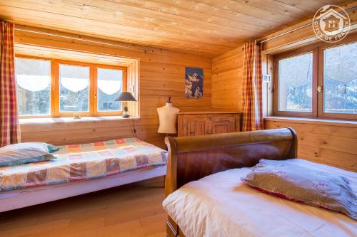 Кровать или кровати в номере Le Chalet de la Vanoise