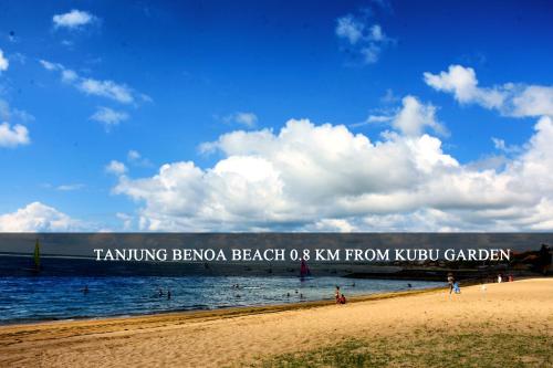 a beach with a sign that reads turning boca beach as kw from k at Kubu Garden Suites & Villas Nusa Dua in Nusa Dua