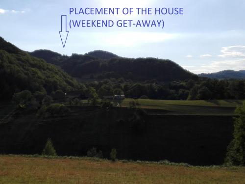 a view of a field with mountains in the background at Getaway "At the three lights" in Sevnica