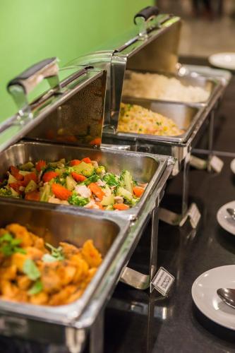 a buffet line with many trays of food at Best Bella Pattaya in Pattaya North