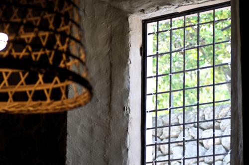 a window with bars on it in a room at Hotel Turixant in Mancor del Valle