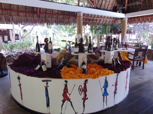 a display of wine bottles on a table at Scorpio Villas Resort in Malindi
