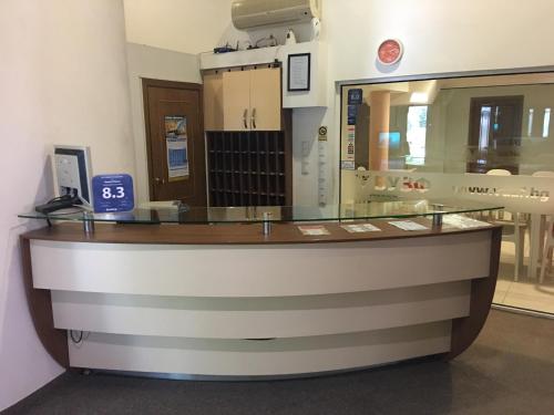 a cashier counter in a store with a glass counter top at Hostel Elena in Sofia