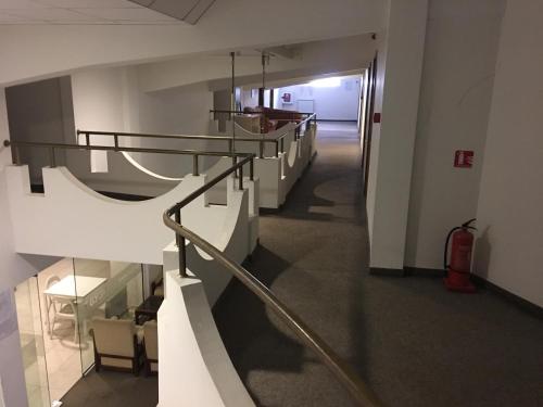 a hallway with a staircase in a building at Hostel Elena in Sofia
