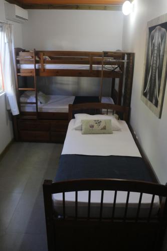 a bedroom with two bunk beds in a room at Alma Brava in Itajaí