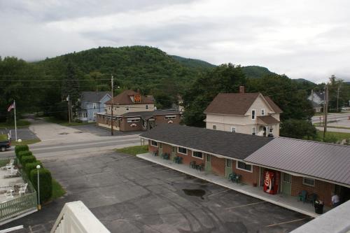 an empty parking lot in front of a building at Northern Peaks Motor Inn in Gorham