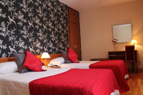 Cama o camas de una habitación en Hotel Montero