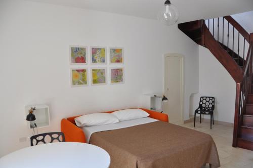 Ένα ή περισσότερα κρεβάτια σε δωμάτιο στο Porta Barsento