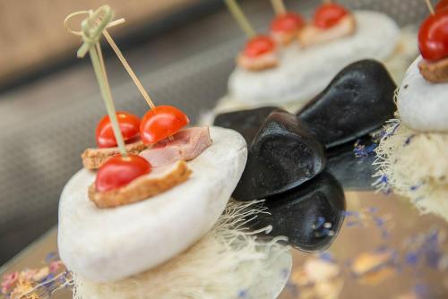 a close up of a cake with fruit on it at Atrium Hotel Thassos in Potos