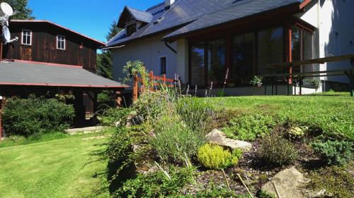 a garden in front of a house at Penzion Vital in Liberec