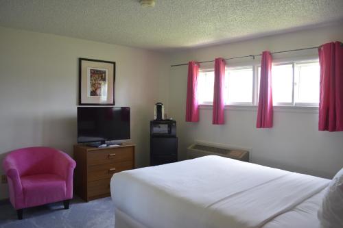 מיטה או מיטות בחדר ב-Retro Inn at Mesa Verde