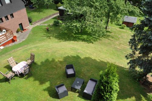 an aerial view of a yard with a table and chairs at Pension Dabrunz in Heimbach