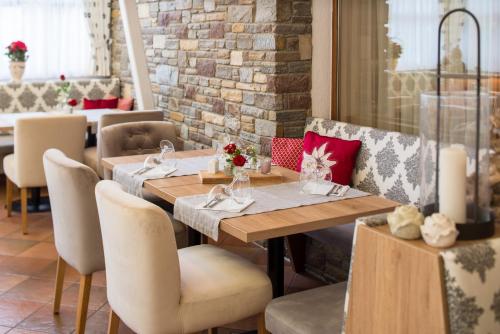 a dining room with a table and chairs at Hotel Diana in Seefeld in Tirol