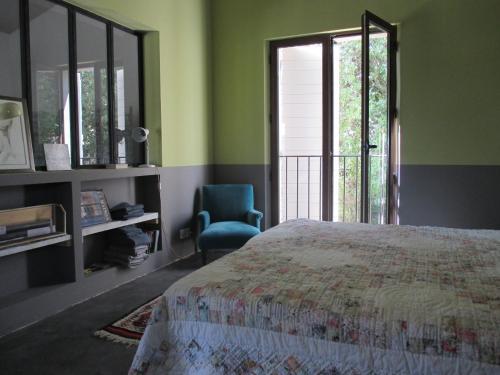 Ένα ή περισσότερα κρεβάτια σε δωμάτιο στο Maison Itzé