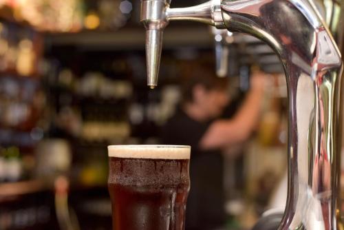 a beer is being poured into a glass at Edenhall Country Hotel in Penrith