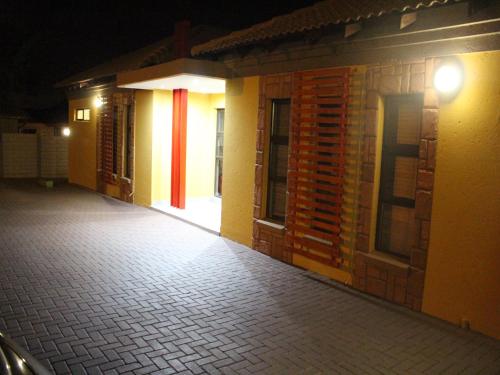 an empty hallway of a building at night at Divine Guest Lodge in Rustenburg