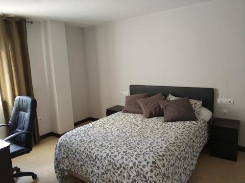 Posteľ alebo postele v izbe v ubytovaní Apartamento Comedias