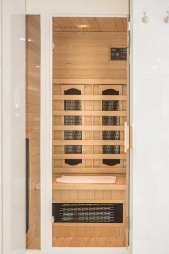 a sauna is shown through a glass door at Luxuslodge Wernigerode in Wernigerode
