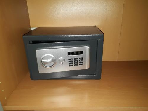 a microwave oven sitting in a box on a table at Residenza Cola Di Rienzo - Suite In Rome in Rome