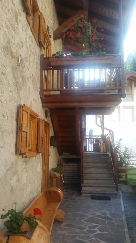 a staircase in a building with some flowers on it at Casa Danoli in Canale San Bovo