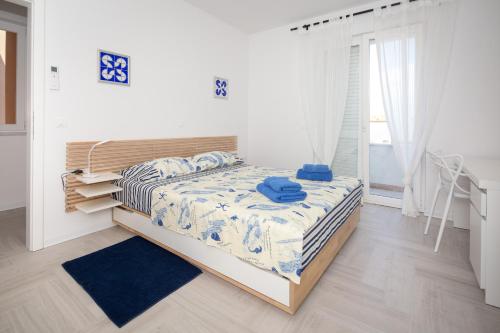 Postel nebo postele na pokoji v ubytování Apartments Tamburini