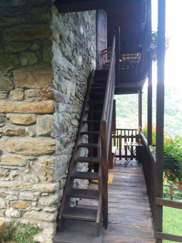 a set of stairs leading up to a stone building at B&B Marcellina in Bard