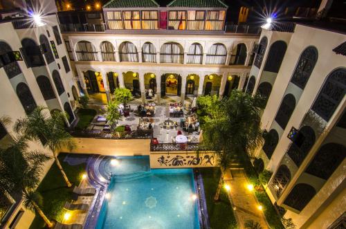 an overhead view of a building with a swimming pool at Palais Ommeyad Suites & Spa in Fès