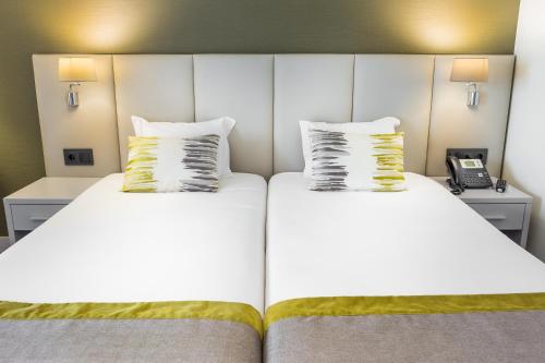 Voodi või voodid majutusasutuse Empire Lisbon Hotel toas