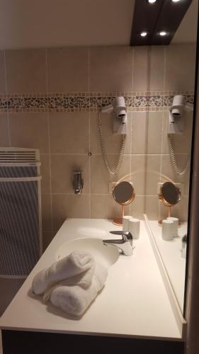 Un baño de hôtel Le Synaya